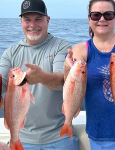 Two anglers with a successful catch of 17-inch fish in SC
