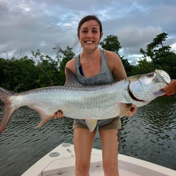 Angler with a large tarpon fish in San Juan