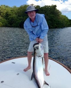 A person fishing for a tarpon in PR