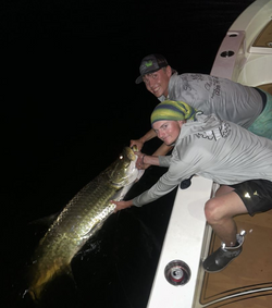 Two people fishing in the beautiful FL location