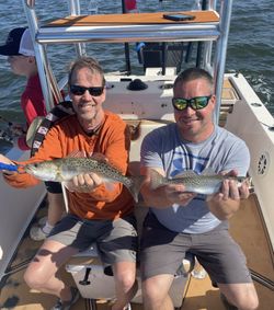 Two spotted weakfish caught by three people fishing in St James City