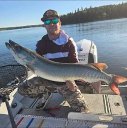 A person fishing for a muskellunge in the Rainy River District