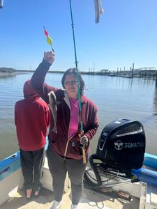 Mom’s ￼ catching red drum like a pro