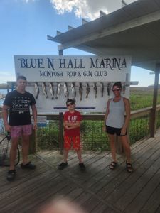 Three people enjoying a fishing trip in GA
