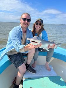 Two people fishing in Darien