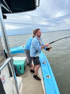 Fisherman with one catch in Darien