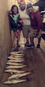 3 people fishing on the beach at South Padre Island