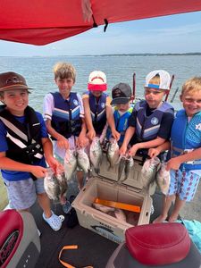 Six people fishing for largemouth bass in Pope