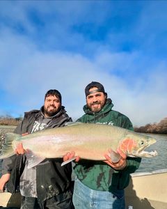 A photo of two people fishing for a pink salmon in Oregon.