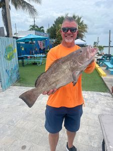 A person fishing with a rod in Marathon, Florida