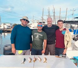 4 people enjoying a fishing trip in Marathon