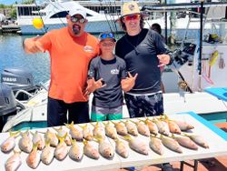 Four people fishing in Marathon, Florida