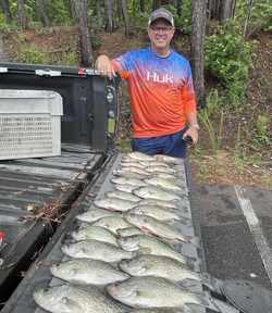 Angler with 3 big fish caught while fishing in Kowaliga