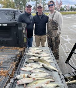 3 people fishing at Kowaliga with 2 big fish