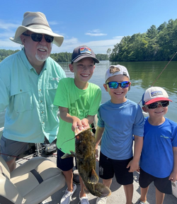 A group of 4 people fishing at Kowaliga location