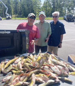 Three people enjoying a fishing trip in Kowaliga