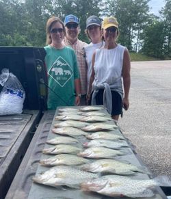 4 happy anglers with a catch of big fish at Kowaliga