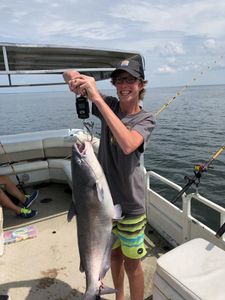 Angler holding a big blue catfish caught while fishing in SC