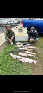 Two anglers fishing in SC with big fish