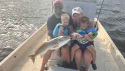 Happy family redfish catch