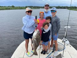 Angler with a big black drum fish in FL