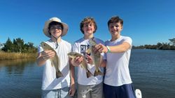 Three redfish caught during fishing trip in Santa Rosa Beach