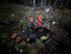 Two people enjoying a day of fishing and hunting in Maine