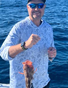 A person fishing in Florida, enjoying the best and greatest fishing adventure.