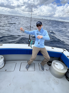 Casting my line, enjoying the day on the open sea.