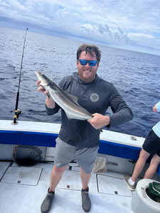 Reeling in the best Cobia at Riviera Beach with storm clouds looming!