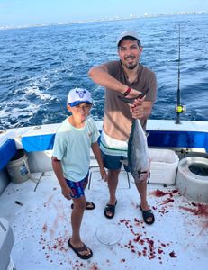A couple enjoys a great fishing tour in West Palm Beach