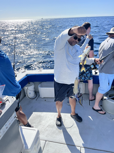 Enjoying a peaceful day on the water, reeling in the catch of the day.