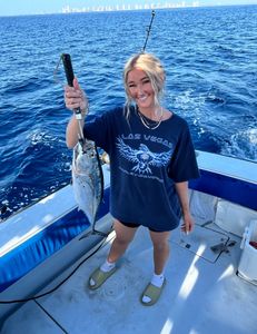 A person fishing in Florida with fishing and tours equipment