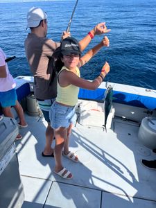 One fisherman reeling in a catch in West Palm Beach