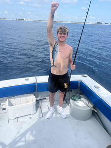 Reeling in a Little Tunny on a partly cloudy day in West Palm Beach!