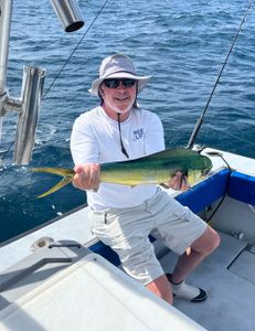 Angler with a 14-inch Mahi Mahi fish in West Palm Beach