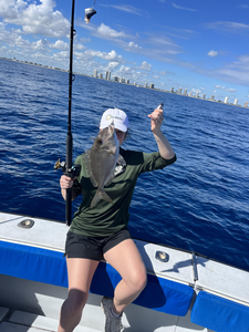 Peaceful day out on the open waters, reeling in a nice catch.