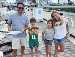 Reeling in a beauty on this sunny day at the marina.