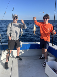 Reeling in the big catch on the open sea.