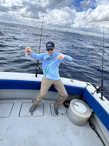 Reeling in the big one on the open waters.