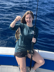 Reeling in the big one on the open ocean.
