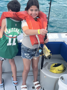 Reeling in the big one on a peaceful day out on the water.