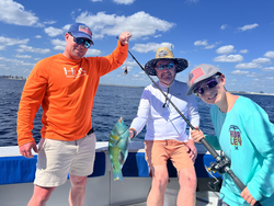 Reeling in the catch of the day on the open water.