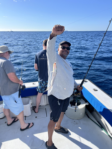 Reeling in the catch of the day on the open waters.