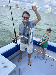 Reeling in a catch on the open waters.
