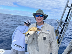Reeling in a good catch on the open waters.