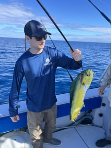 Reeling in a nice catch on the open waters.