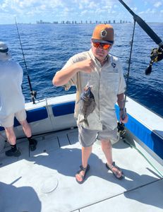 Angler with a fishing rod standing in Riviera Beach