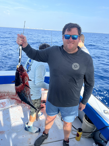 Battling the storms for the best catch in West Palm Beach!