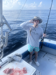 Partly cloudy skies set the stage for an epic day of deep sea action!